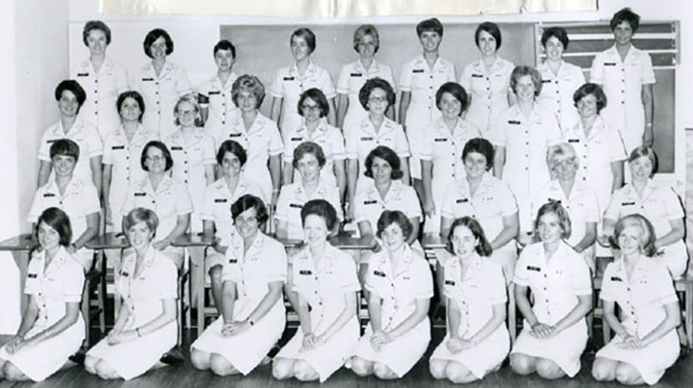 Marcella Niehoff School of Nursing Professor Emerita Diana Hackbarth is shown in the second row, far right, of this 1968 photo of graduating U.S. Navy nurses. Hackbarth is leading a group of retired School of Nursing faculty, assisted by a Loyola University Chicago archivist, that is seeking to find Loyola nurse veterans and document their stories. 